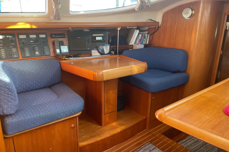 Slide: The Image of Cozy interior of 2003 Jeanneau Sun Odyssey 43 DS sailboat with navigation equipment. - 14