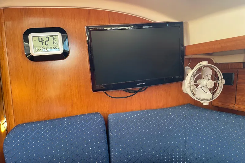 Slide: The Image of Interior of 2003 Jeanneau Sun Odyssey 43 DS with TV, clock, and fan. - 17