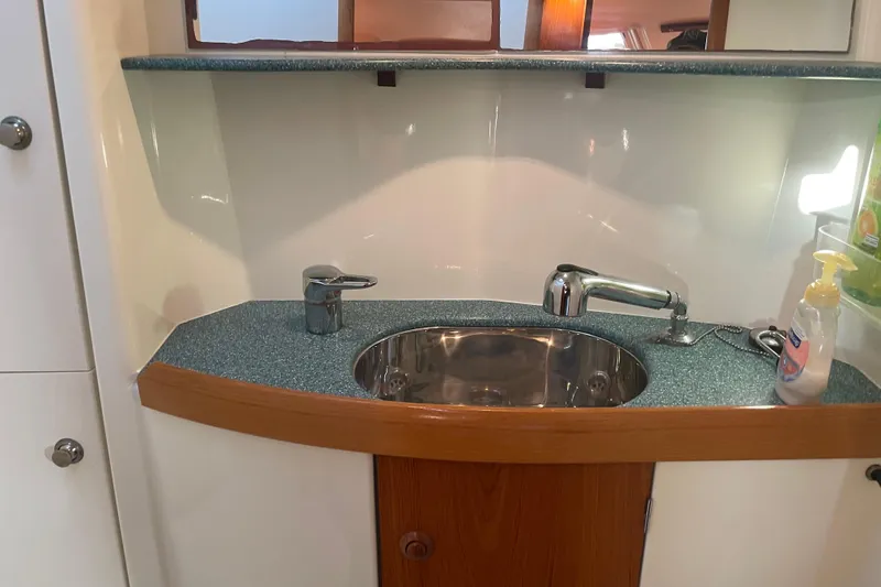 Slide: The Image of Bathroom sink area in a 2003 Jeanneau Sun Odyssey 43 DS yacht. - 21