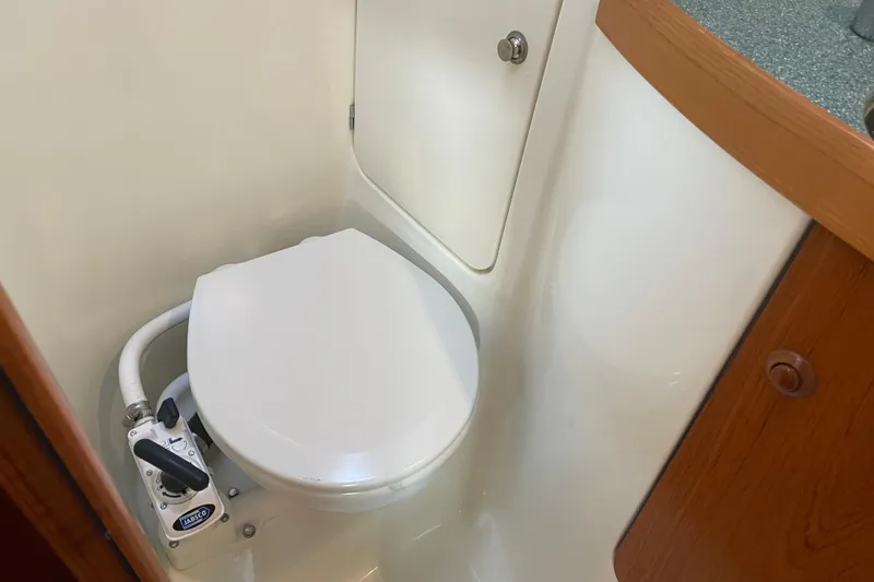 Slide: The Image of 2003 Jeanneau Sun Odyssey 43 DS yacht bathroom with marine toilet and storage. - 22
