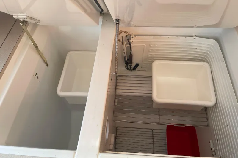 Slide: The Image of Interior view of Jeanneau Sun Odyssey 43 DS 2003 yacht's storage compartments. - 31