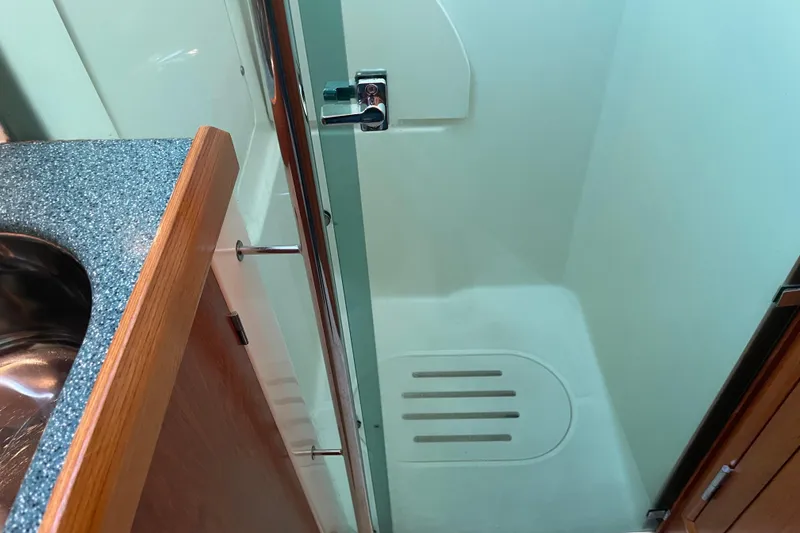 Slide: The Image of Shower area in 2003 Jeanneau Sun Odyssey 43 DS yacht bathroom. - 36
