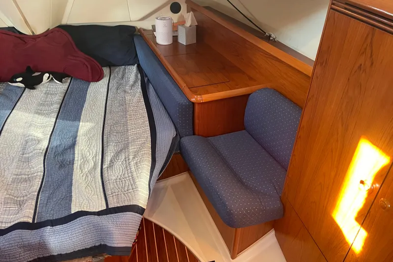 Slide: The Image of Cozy cabin interior of 2003 Jeanneau Sun Odyssey 43 DS with bed and seating area. - 38