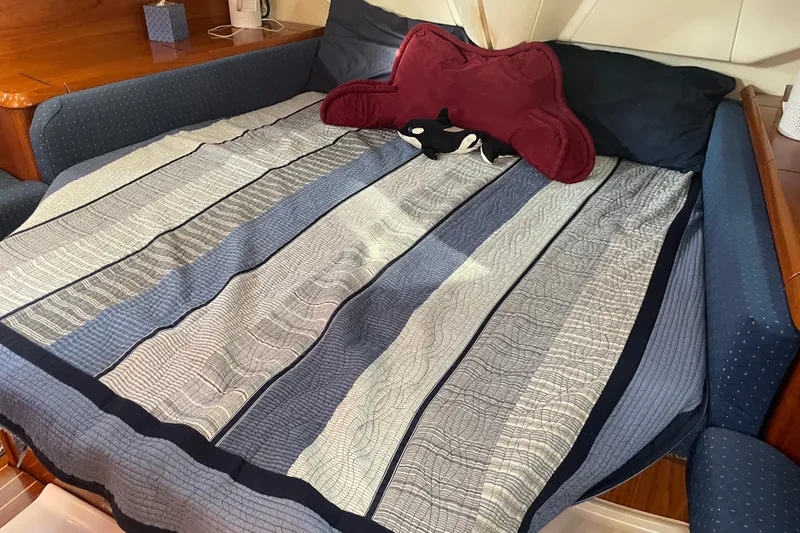 Slide: The Image of Cozy cabin bed in 2003 Jeanneau Sun Odyssey 43 DS yacht with striped bedding. - 39