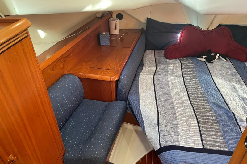 Slide: The Image of Cozy cabin interior of 2003 Jeanneau Sun Odyssey 43 DS with bed and seating area. - 40