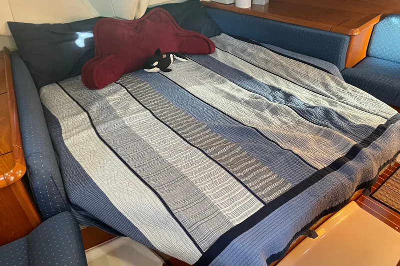 Slide: The Image of Cozy cabin bed in 2003 Jeanneau Sun Odyssey 43 DS yacht with striped bedding. - 42