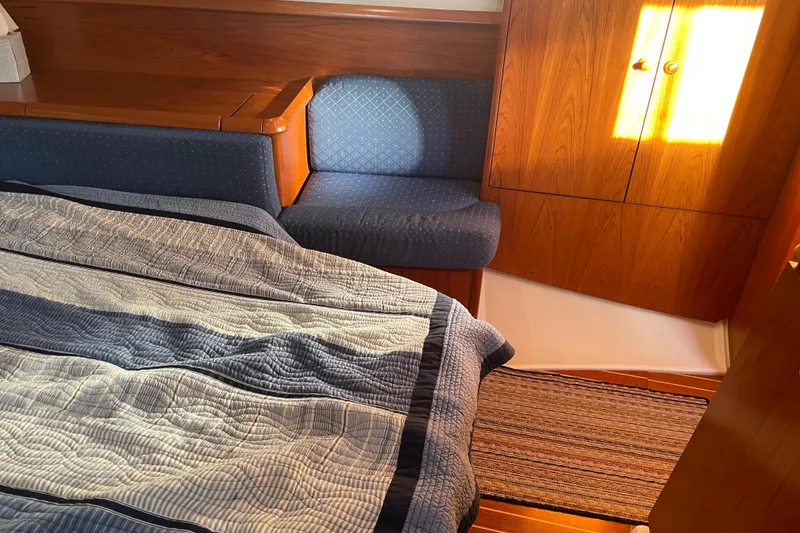 Slide: The Image of Cozy cabin interior of 2003 Jeanneau Sun Odyssey 43 DS sailboat with wooden furnishings. - 43
