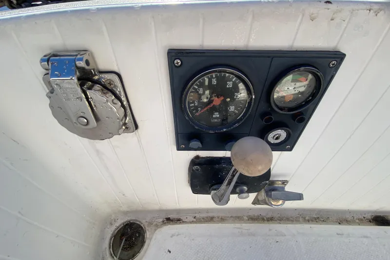 Slide: The Image of Control panel of a 1978 Bristol Channel Cutter 28 sailboat, featuring gauges and levers. - 15