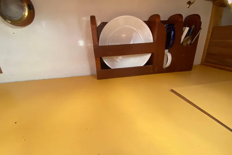 Slide: The Image of Wooden dish rack on yellow countertop in 1978 Bristol Channel Cutter 28. - 28