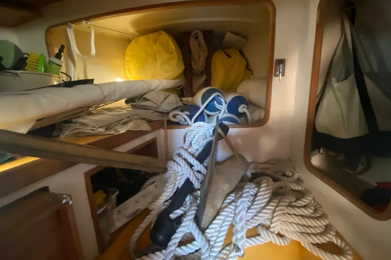 Slide: The Image of Interior of a 1978 Bristol Channel Cutter 28 with ropes and sailing gear. - 35