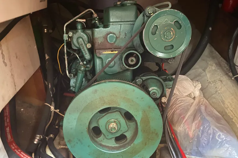 Slide: The Image of Engine of a 1978 Bristol Channel Cutter 28 sailboat, featuring visible belts and pulleys. - 39