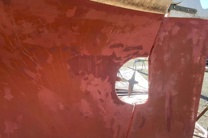 Slide: The Image of Hull of a 1978 Bristol Channel Cutter 28 with red paint. - 4