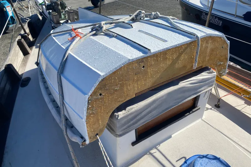 Slide: The Image of 1978 Bristol Channel Cutter 28 with a secured dinghy on deck. - 9