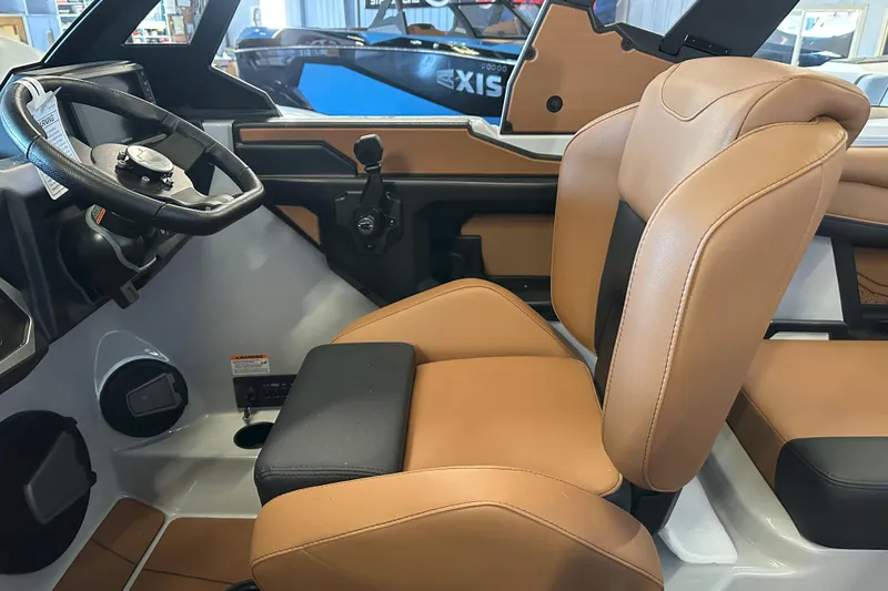 Slide: The Image of Interior of 2026 Axis A225 boat with tan leather seats and steering wheel. - 5