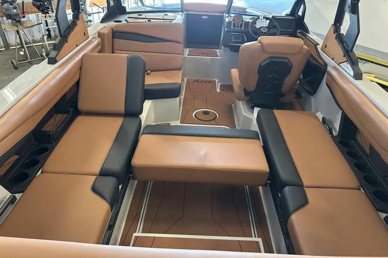 Slide: The Image of Luxurious interior of 2026 Axis A225 boat with tan and black seating. - 9