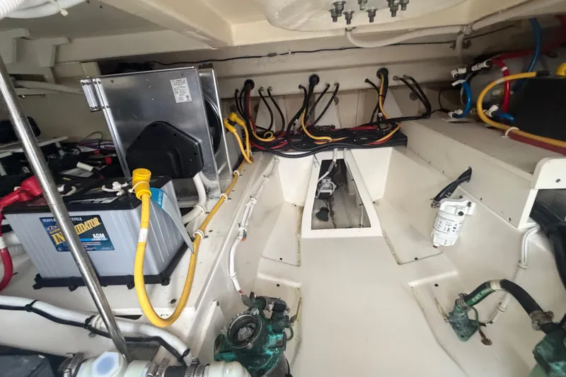 Slide: The Image of Engine room of 2021 Tiara Yachts 43 LE, showcasing batteries and wiring. - 31