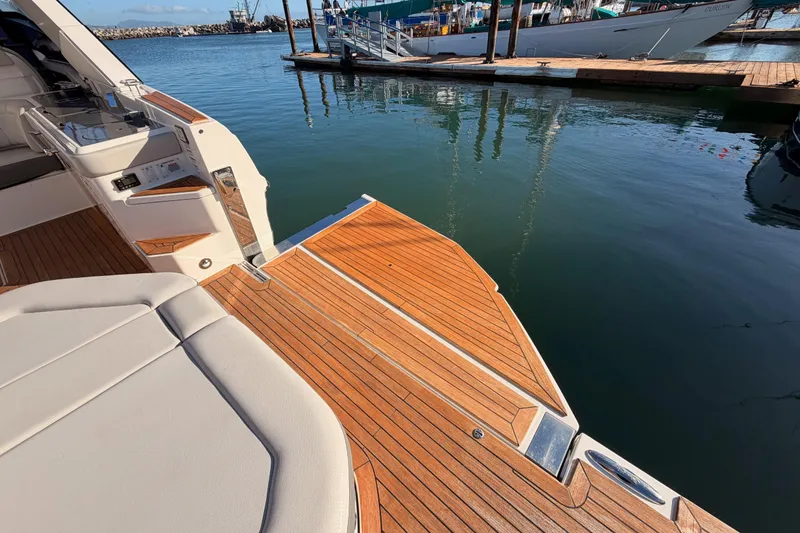 Slide: The Image of 2021 Sea Ray SLX 400 yacht with teak deck at marina. - 17