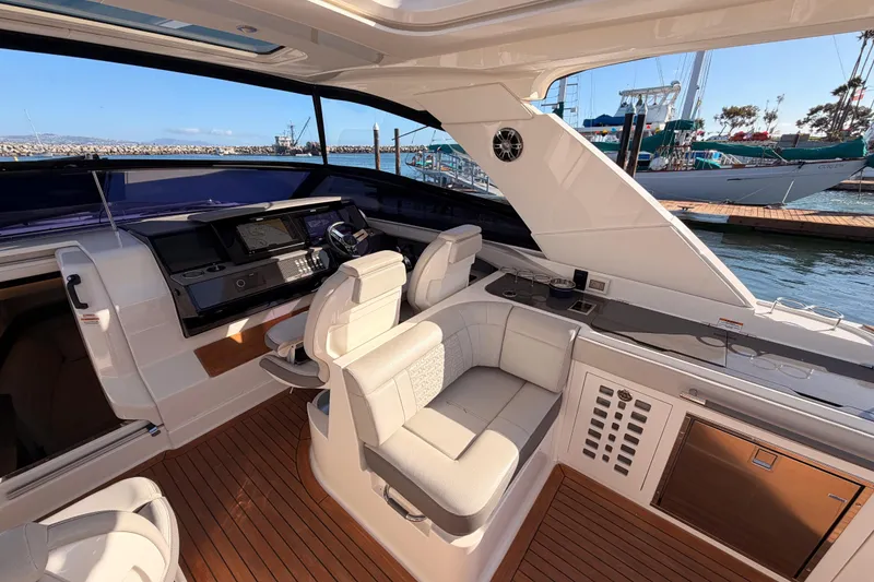 Slide: The Image of Luxurious 2021 Sea Ray SLX 400 yacht interior with plush seating and modern helm. - 26