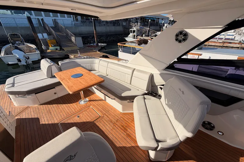 Slide: The Image of Luxurious 2021 Sea Ray SLX 400 yacht interior with elegant seating and wooden deck. - 30