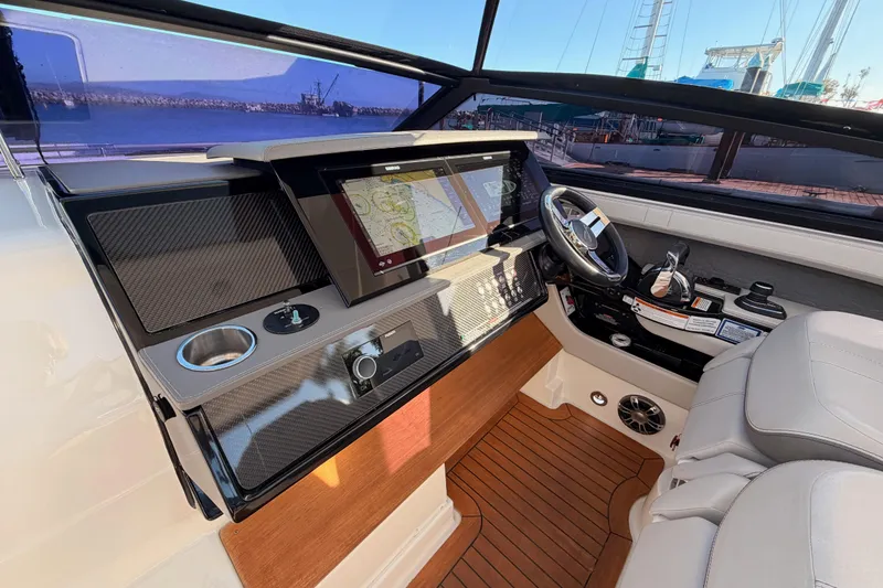 Slide: The Image of 2021 Sea Ray SLX 400 helm with modern navigation system and luxurious seating. - 32