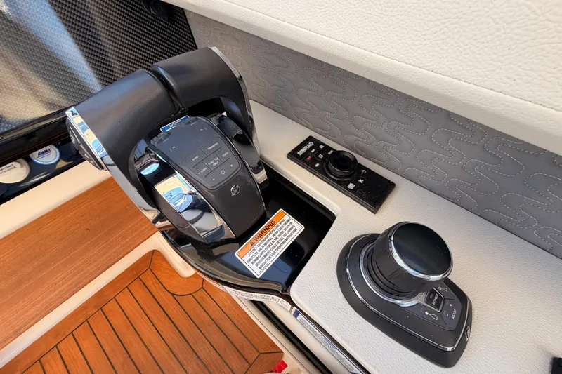 Slide: The Image of Control panel of 2021 Sea Ray SLX 400 boat with joystick and throttle. - 34