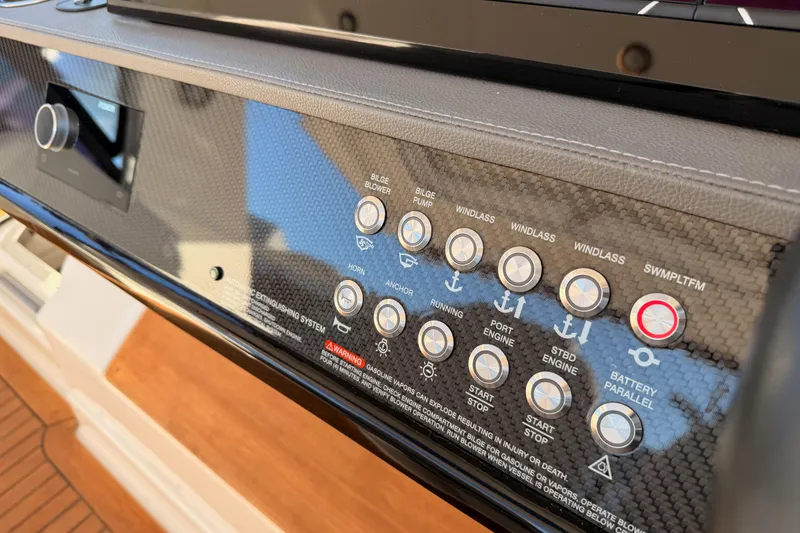 Slide: The Image of Control panel of 2021 Sea Ray SLX 400 boat with various function buttons. - 36