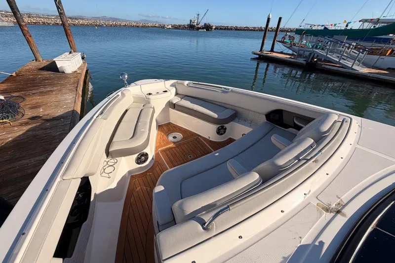 Slide: The Image of 2021 Sea Ray SLX 400 boat docked, featuring spacious seating and elegant design. - 41