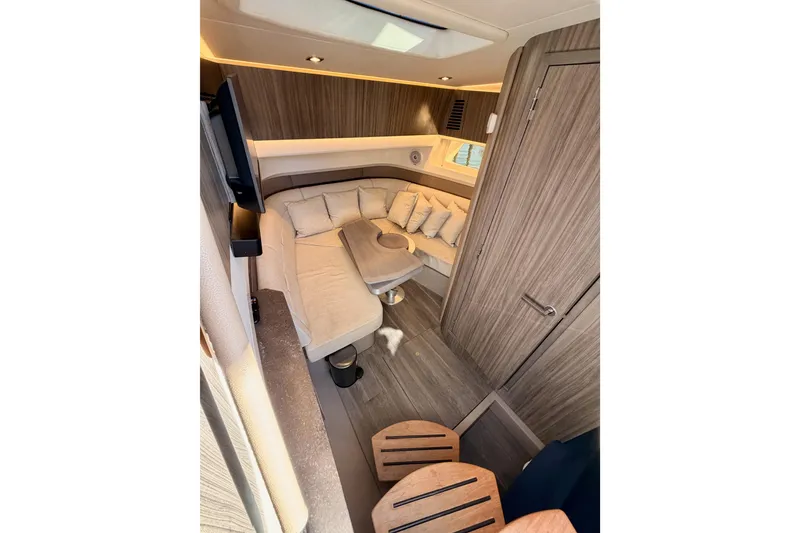 Slide: The Image of Luxurious interior of 2021 Sea Ray SLX 400 yacht with cozy seating and modern design. - 53