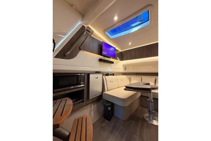 Slide: The Image of Luxurious interior of 2021 Sea Ray SLX 400 yacht with modern amenities and elegant design. - 54