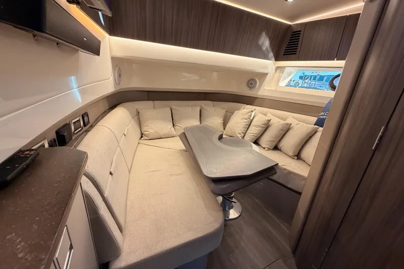 Slide: The Image of Luxurious interior of 2021 Sea Ray SLX 400 yacht with plush seating and modern design. - 57