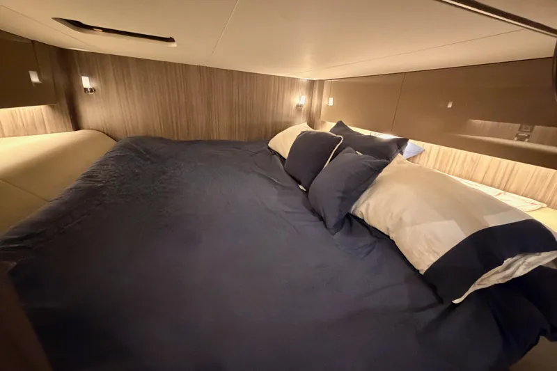 Slide: The Image of Luxurious cabin interior of 2021 Sea Ray SLX 400 with cozy bedding. - 65