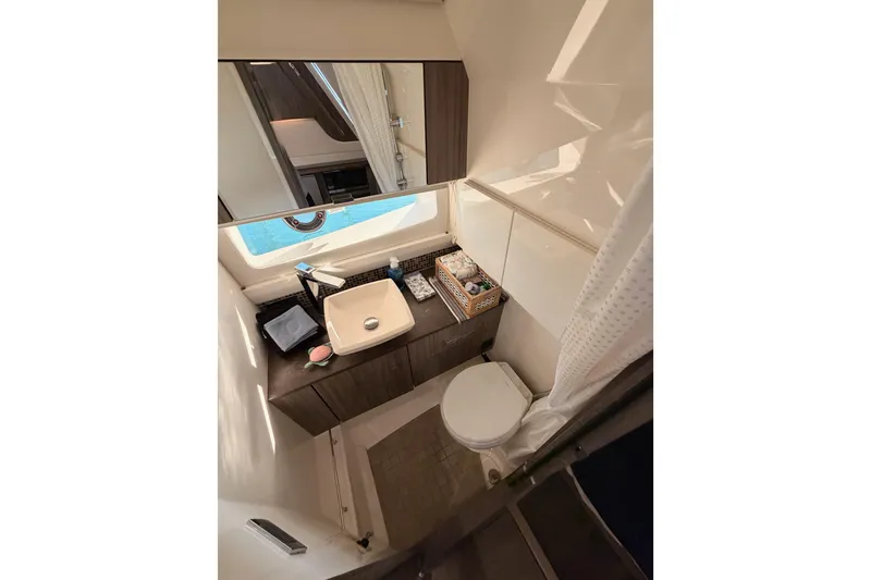 Slide: The Image of Luxurious bathroom interior of 2021 Sea Ray SLX 400 yacht, featuring modern amenities. - 68