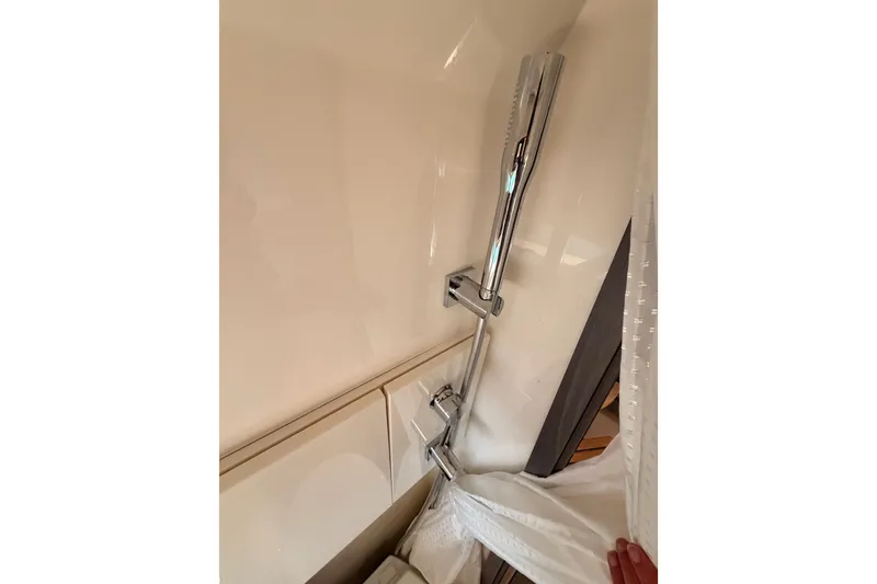 Slide: The Image of Shower area in 2021 Sea Ray SLX 400 boat with chrome fixtures. - 69