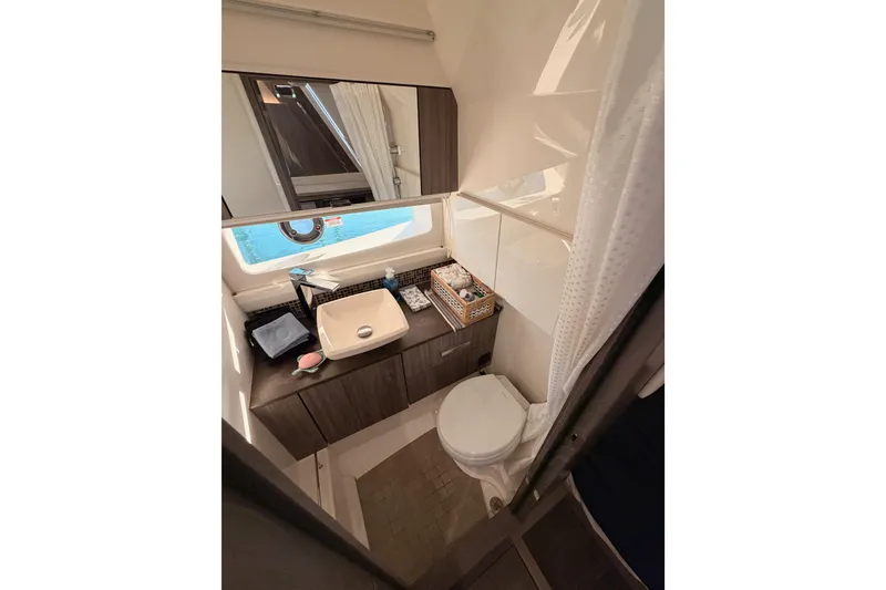 Slide: The Image of Luxurious bathroom in 2021 Sea Ray SLX 400 yacht with modern fixtures and elegant design. - 70