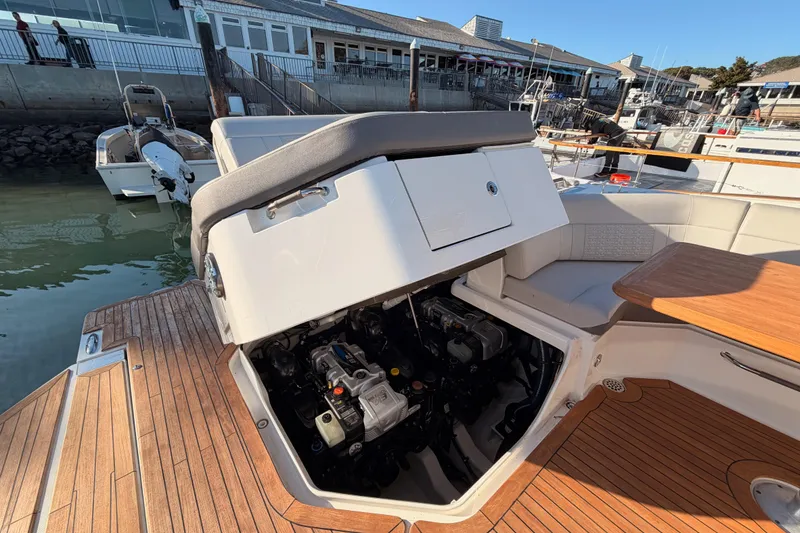 Slide: The Image of 2021 Sea Ray SLX 400 boat with open engine compartment at dock. - 78