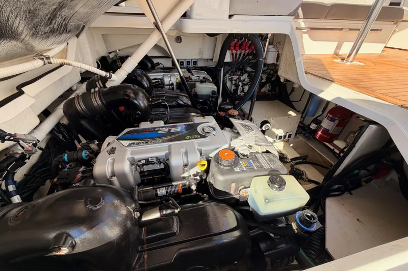 Slide: The Image of Engine compartment of a 2021 Sea Ray SLX 400 boat, showcasing detailed mechanical components. - 84