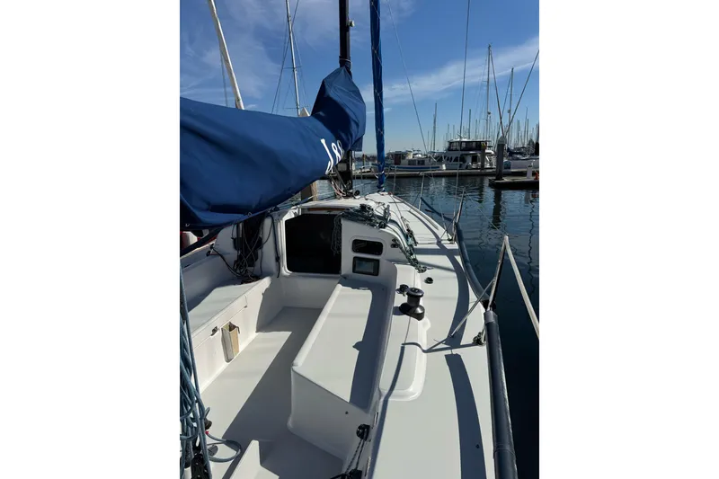 Slide: The Image of 2014 J Boats J/88 sailboat docked in a marina under clear blue skies. - 11