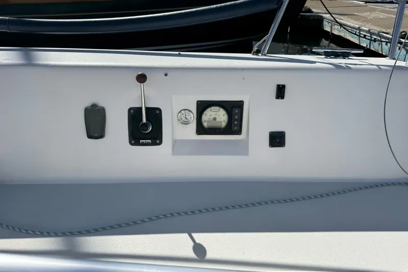 Slide: The Image of Control panel of a 2014 J Boats J/88 sailboat, featuring gauges and switches. - 13