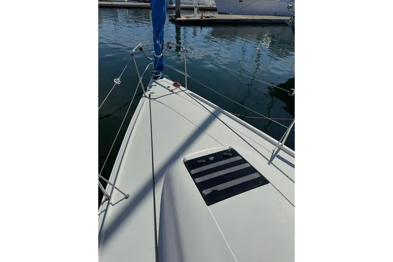 Slide: The Image of Bow view of a 2014 J Boats J/88 sailboat docked in calm waters. - 17