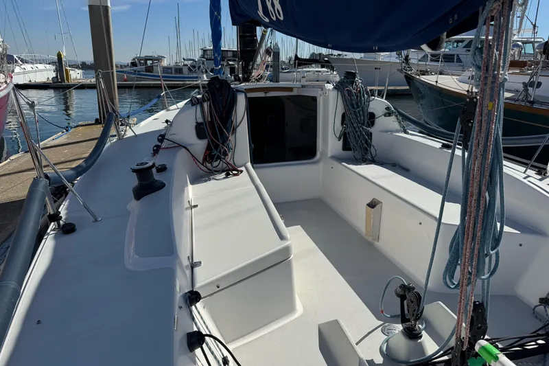 Slide: The Image of 2014 J Boats J/88 sailboat cockpit with ropes and winches at marina. - 19