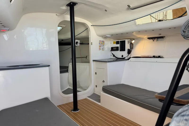 Slide: The Image of Interior of 2014 J Boats J/88 sailboat, featuring modern design and navigation equipment. - 20