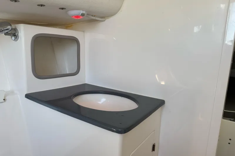 Slide: The Image of Interior of 2014 J Boats J/88 showing a compact sink and countertop. - 23