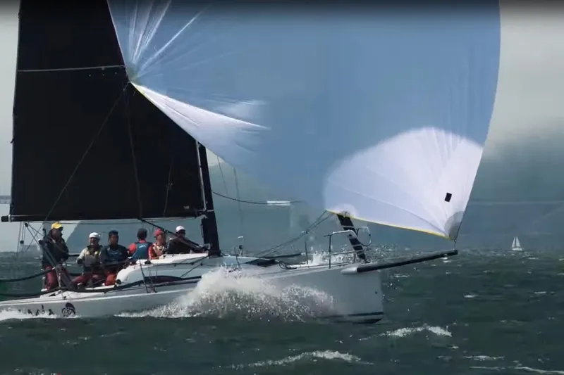 Slide: The Image of Sailing J Boats J/88, 2014 model, with crew navigating choppy waters. - 30