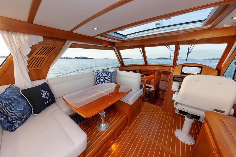 Slide: The Image of Luxurious interior of 2022 Sabre 38 SE yacht with elegant wood finish and ocean view. - 12