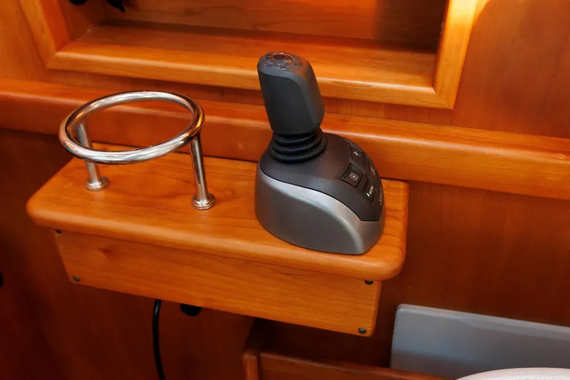 Slide: The Image of Joystick control on 2022 Sabre 38 SE yacht, mounted on wooden panel. - 18