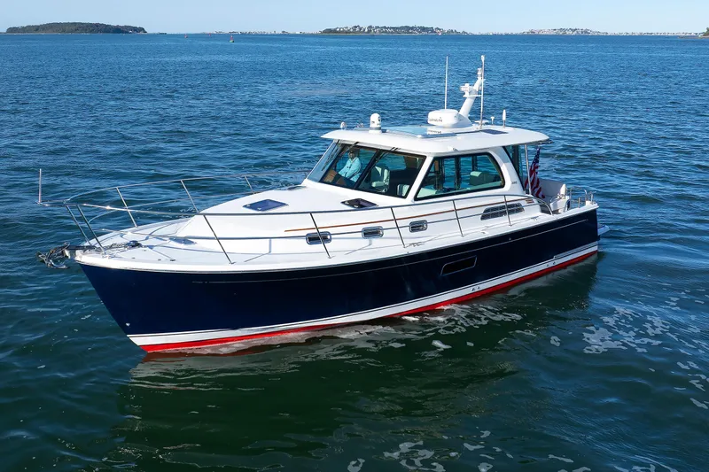 Slide: The Image of 2022 Sabre 38 SE yacht cruising on open water, showcasing sleek design and elegance. - 3