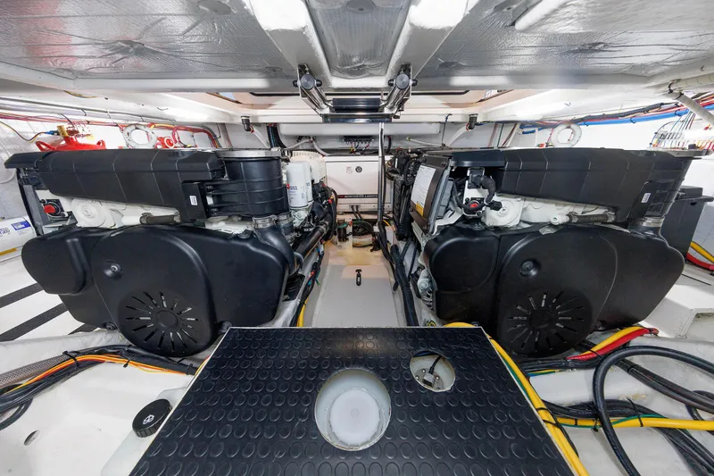 Slide: The Image of Engine room of 2022 Sabre 38 SE yacht, featuring dual engines and organized wiring. - 33