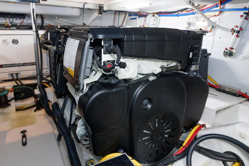 Slide: The Image of Engine room of 2022 Sabre 38 SE yacht with visible machinery and wiring. - 34