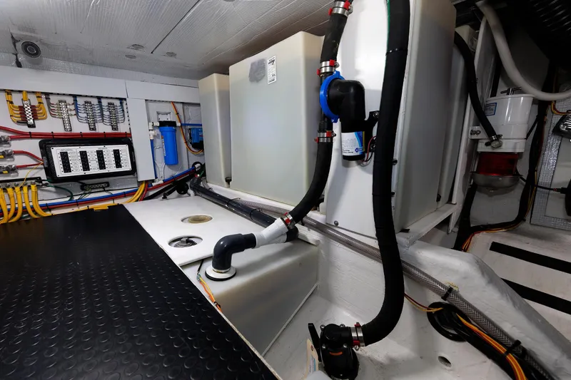 Slide: The Image of Engine room of 2022 Sabre 38 SE yacht with wiring and plumbing systems. - 38