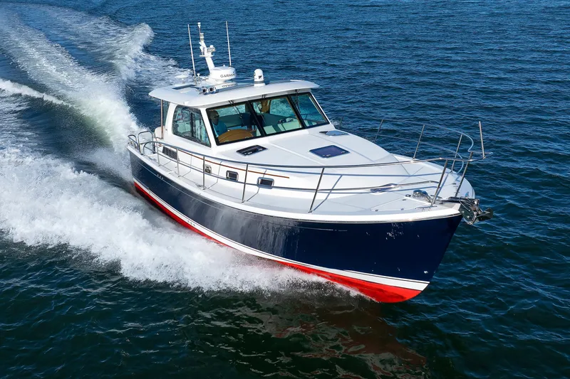 Slide: The Image of 2022 Sabre 38 SE yacht cruising on open water, showcasing sleek design and performance. - 50